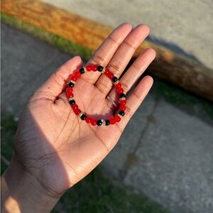Striking Red and Black Bracelet with Intricate Design